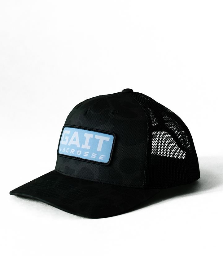 Black Camo Light Blue Patch Trucker Hat
